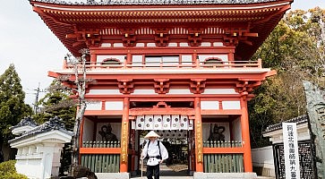 Naruto, Japan - April 2, 2018: Pilgrim at the entrance to Gokurakuji, temple number 2 of Shikoku pilgrimage
