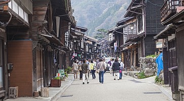 TAKAYAMA, JAPAN - MAY 03: Unidentified people at Sannomachi Street, the old town area which has museums and old private houses, some survive from Edo period on May 03, 2014 in Takayama, Japan.