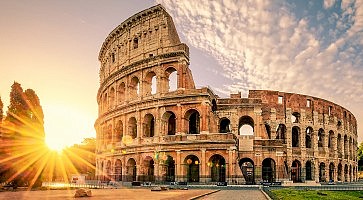 sunrise behind Colosseum in Rome Italy